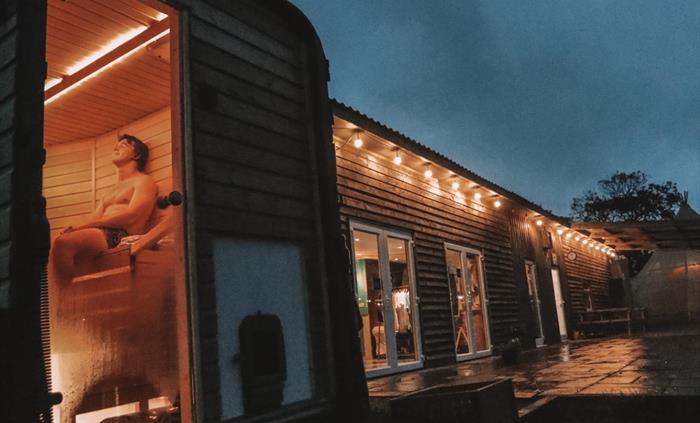 Bask in the comforting embrace of warmth at Logi Saunas, as the golden glow envelops you in a cocoon of relaxation and tranquility.